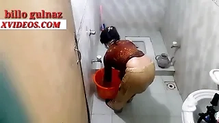 Indian girl taking a bath down the bathroom